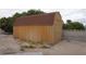 Backyard shed offers extra storage, complemented by a block wall and low-maintenance landscaping at 6432 Jean Lee Dr, Las Vegas, NV 89108