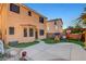 The backyard features a concrete patio, playhouse, basketball hoop, and manicured synthetic grass at 644 Mauna Kea Pl, Henderson, NV 89011