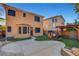 The backyard features a concrete patio, playhouse, basketball hoop, and manicured synthetic grass at 644 Mauna Kea Pl, Henderson, NV 89011