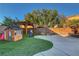 Gathering-friendly backyard with turf, playhouse, half basketball court, and pergola at 644 Mauna Kea Pl, Henderson, NV 89011