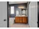 This bathroom has double sinks, a vanity, a tub, and a walk-in shower for added convenience at 644 Mauna Kea Pl, Henderson, NV 89011