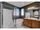 This bathroom has double sinks, a vanity, a tub, and a walk-in shower for added convenience at 644 Mauna Kea Pl, Henderson, NV 89011