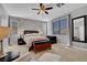 This spacious bedroom has a ceiling fan, a window, and an ensuite bathroom for added privacy and comfort at 644 Mauna Kea Pl, Henderson, NV 89011