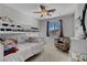 This cozy bedroom has a ceiling fan, a large window, and a closet for added convenience and functionality at 644 Mauna Kea Pl, Henderson, NV 89011