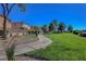 The community park has mature trees, a walking path, open green space, and well-maintained landscaping at 644 Mauna Kea Pl, Henderson, NV 89011