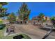 The community park boasts benches, mature trees, walking paths, and desert landscaping at 644 Mauna Kea Pl, Henderson, NV 89011