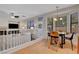 Bright dining area shows a round table, modern light fixture, and seating for four near a living room space at 644 Mauna Kea Pl, Henderson, NV 89011