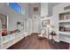 Bright, open area featuring hardwood floors, high ceilings, and shelving units that accent the space at 644 Mauna Kea Pl, Henderson, NV 89011