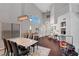Elegant dining area with high ceilings, a modern chandelier, and a large marble-top table with seating for six at 644 Mauna Kea Pl, Henderson, NV 89011