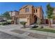 Charming two-story home with an arched entry, two-car garage, and desert landscaping at 644 Mauna Kea Pl, Henderson, NV 89011