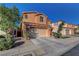 Beautiful two-story home boasts a two-car garage, desert landscaping, and modern design at 644 Mauna Kea Pl, Henderson, NV 89011