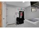 Bright laundry room with washer, dryer, and built-in shelves at 644 Mauna Kea Pl, Henderson, NV 89011