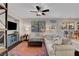 Bright living room featuring a ceiling fan, modern furniture, and a colorful rug at 644 Mauna Kea Pl, Henderson, NV 89011