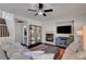 Bright living room featuring a ceiling fan, modern furniture, and a colorful rug at 644 Mauna Kea Pl, Henderson, NV 89011