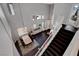 Open concept staircase with hardwood floors leading to a dining area at 644 Mauna Kea Pl, Henderson, NV 89011