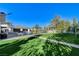 Lush backyard with a pool, volleyball net, ping pong table, and seating areas for entertaining and relaxation at 6965 Tara Ave, Las Vegas, NV 89117