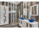 Bright bathroom featuring a glass-enclosed shower and dual vessel sinks at 6965 Tara Ave, Las Vegas, NV 89117