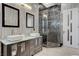 Stylish bathroom with dual sinks and a glass-enclosed shower at 6965 Tara Ave, Las Vegas, NV 89117