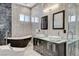 Sleek bathroom with modern fixtures, soaking tub, and tiled walls at 6965 Tara Ave, Las Vegas, NV 89117