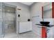 Stylish bathroom featuring modern vanity, sleek fixtures, and a luxurious walk-in shower at 6965 Tara Ave, Las Vegas, NV 89117