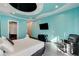 This modern bedroom has a sleek entertainment center and a comfy leather recliner, perfect for relaxation at 6965 Tara Ave, Las Vegas, NV 89117