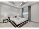This bedroom is equipped with a sleek modern bed, soft neutral colors, and modern recessed lighting at 6965 Tara Ave, Las Vegas, NV 89117