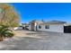 Expansive one-story home offering a generous driveway, stylish design, and a secure gated entrance at 6965 Tara Ave, Las Vegas, NV 89117