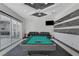 Spacious game room with pool table, comfortable seating, and sliding glass doors to enjoy the outdoors at 6965 Tara Ave, Las Vegas, NV 89117