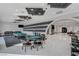 Open game room featuring a pool table, card table, and comfortable seating for leisure and entertainment at 6965 Tara Ave, Las Vegas, NV 89117