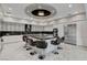 The spacious kitchen offers a large island with seating and stainless appliances at 6965 Tara Ave, Las Vegas, NV 89117