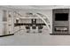Gourmet kitchen features an island with bar seating and sleek cabinets at 6965 Tara Ave, Las Vegas, NV 89117