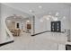 Open-concept living space showcasing marble floors, custom ceiling details, and seamless flow to dining at 6965 Tara Ave, Las Vegas, NV 89117