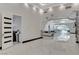Bright and spacious living room featuring sleek marble floors, modern archways, and recessed lighting at 6965 Tara Ave, Las Vegas, NV 89117