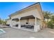 Expansive outdoor kitchen with stone fireplace, ample seating, and a full cooking setup at 6965 Tara Ave, Las Vegas, NV 89117