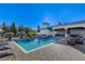 Sparkling pool with a built-in hot tub, surrounded by lounge chairs and manicured landscaping for a serene oasis at 6965 Tara Ave, Las Vegas, NV 89117