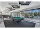 Inviting recreation space with pool table, wet bar, and sliding glass doors leading to the pool at 6965 Tara Ave, Las Vegas, NV 89117
