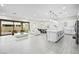Bright and airy living room with modern decor, open floor plan, and sliding door access to the backyard at 717 Monroe Hill Pl, Henderson, NV 89011