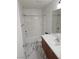 Bright bathroom featuring marble-patterned tile flooring, bath-shower combination, and vanity at 7461 Enviable Ct, Las Vegas, NV 89149