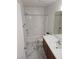 Bright bathroom featuring marble-patterned tile flooring, bath-shower combination, and vanity at 7461 Enviable Ct, Las Vegas, NV 89149