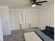 Bedroom featuring plush carpet, ceiling fan and an ensuite bathroom at 7461 Enviable Ct, Las Vegas, NV 89149