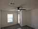 Carpeted bedroom with ceiling fan and outdoor access at 7461 Enviable Ct, Las Vegas, NV 89149