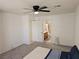 Bright bedroom with ceiling fan and ensuite bathroom for added privacy and convenience at 7461 Enviable Ct, Las Vegas, NV 89149