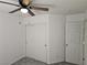 Cozy bedroom featuring a ceiling fan, neutral paint, carpet flooring, and a closet at 7461 Enviable Ct, Las Vegas, NV 89149