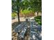 A well-maintained community park offering benches, mature trees, and a walking path for residents' enjoyment at 7461 Enviable Ct, Las Vegas, NV 89149