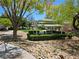 A serene community park with a gazebo, perfect for relaxing and enjoying the outdoors with lush landscaping at 7461 Enviable Ct, Las Vegas, NV 89149