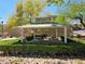 Charming community picnic pavilion featuring well-manicured hedges, convenient grills, and communal seating at 7461 Enviable Ct, Las Vegas, NV 89149
