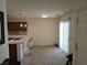 Bright dining area features tile floors, modern lighting and convenient access to the kitchen and sliding door at 7461 Enviable Ct, Las Vegas, NV 89149
