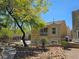 A beautiful condo featuring a stucco exterior, private balcony, and desert landscaping, perfect for outdoor living at 7461 Enviable Ct, Las Vegas, NV 89149