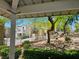 Exterior view of well-maintained homes with lush landscaping, shrubs, and trees creating a welcoming atmosphere at 7461 Enviable Ct, Las Vegas, NV 89149