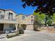 Well-maintained two-story house featuring an attached garage, neutral exterior paint, and tidy landscaping on a sunny day at 7461 Enviable Ct, Las Vegas, NV 89149